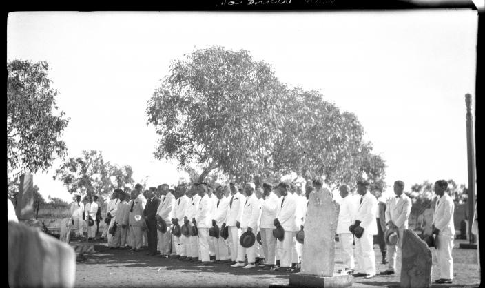 A group of people attending a ceremony. 